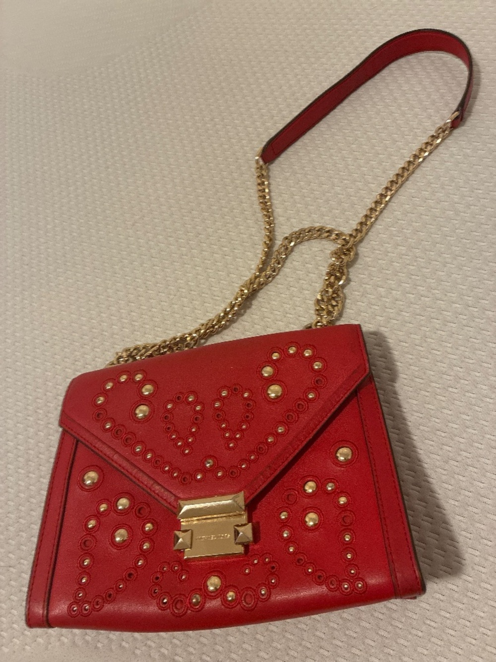 Red Michael Kors handbag